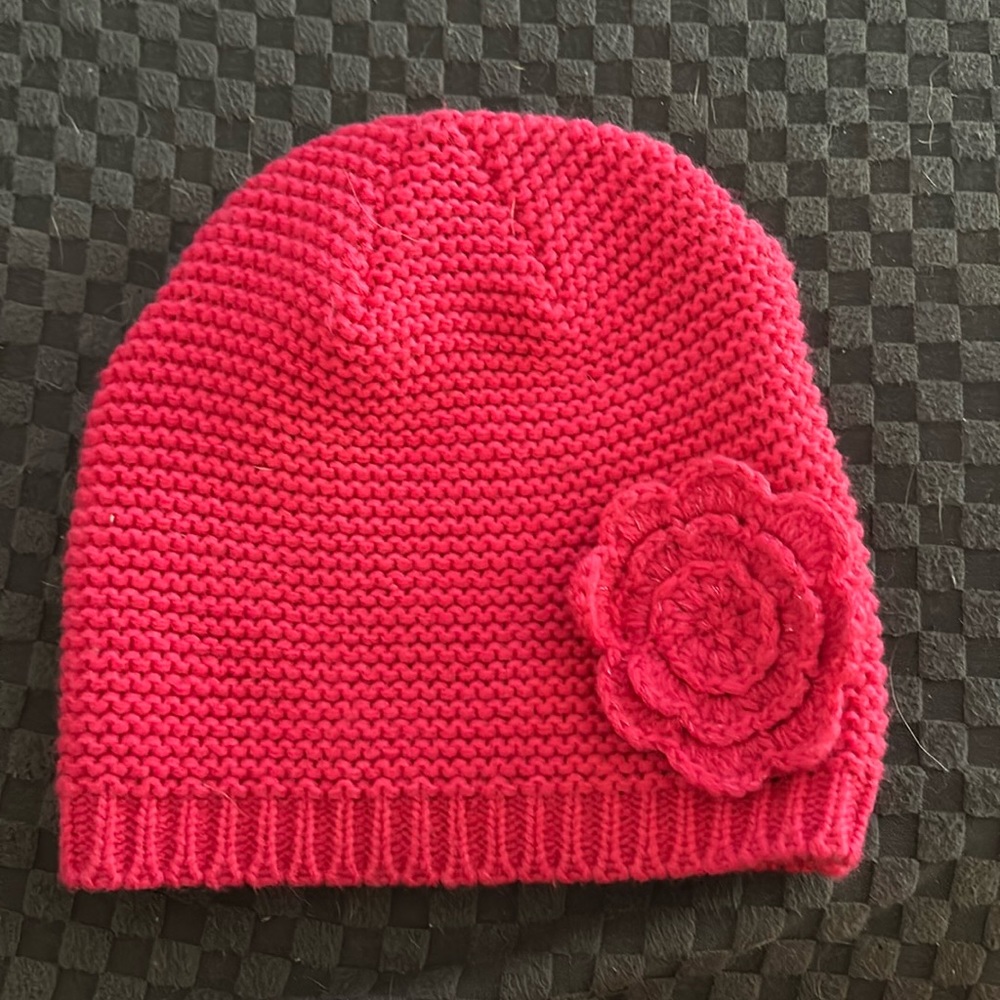 handmade, crocheted, pink beanie, with a pink flower on it